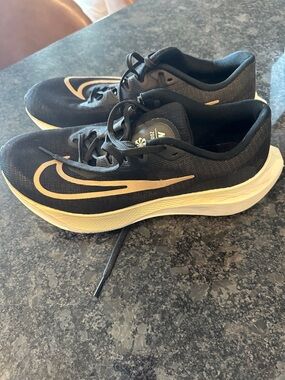 Nike Black Running Shoes with Cream Swoosh and Midsole